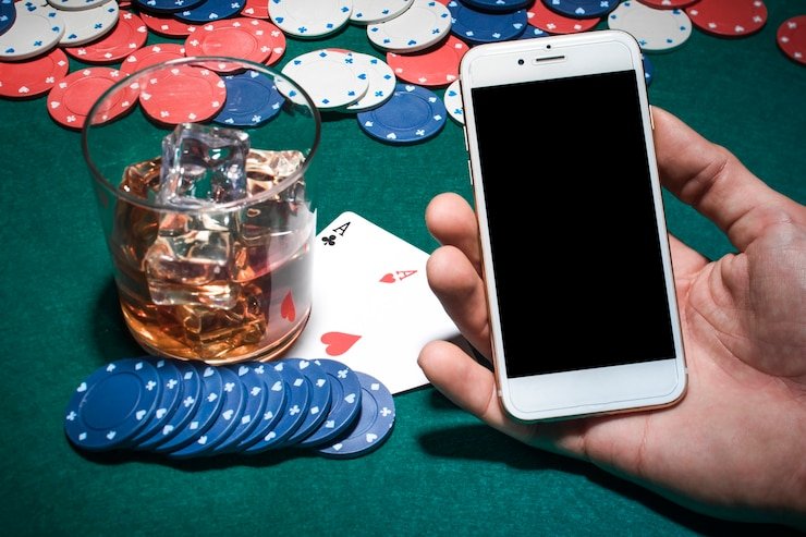 Mobile phone showing live blackjack table and dashboard